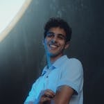 Smiling Man in a Blue Polo Shirt